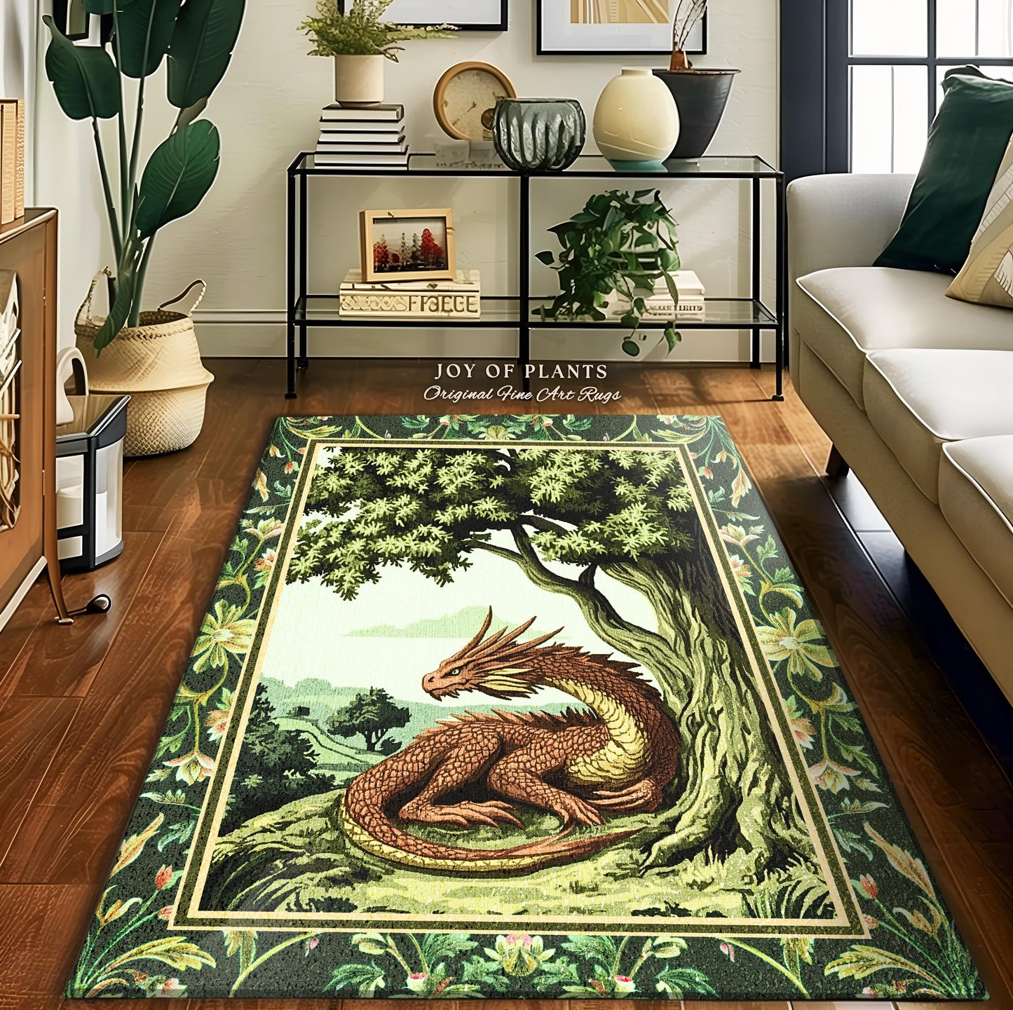 May include: A green and brown area rug features a tapestry-style illustration of a dragon nestled under a large tree. The rug has a detailed border with floral motifs. The text 'JOY OF PLANTS Original Fine Art Rugs' is visible. The rug's color palette consists of deep greens, browns, and creams, creating a whimsical, nature-inspired design. This rectangular rug is suitable for living rooms or bedrooms.