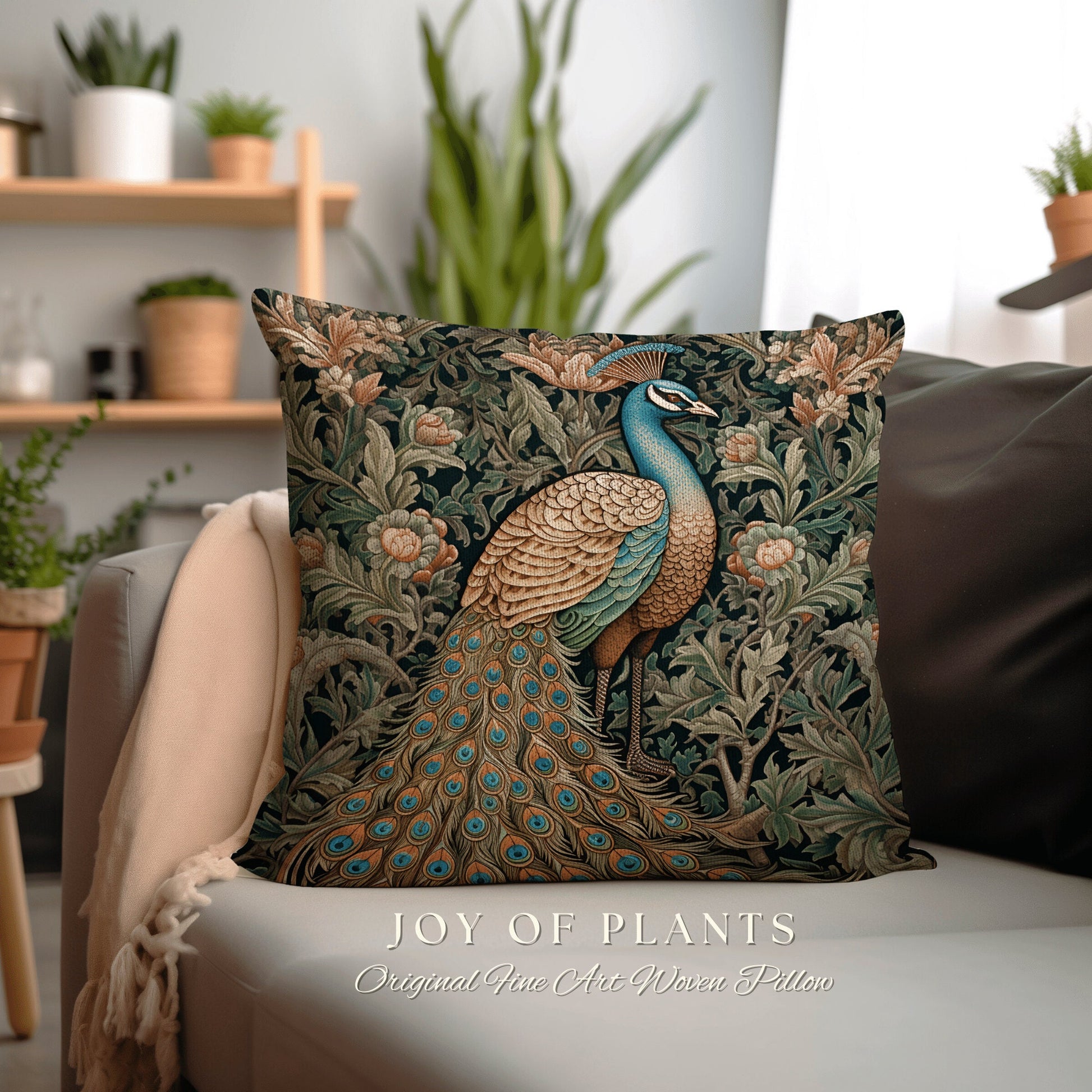 May include: A square throw pillow with a peacock design. The peacock is blue, green, and gold with a long tail of green and blue feathers. The background is a dark green with floral patterns. The text 'JOY OF PLANTS' and 'Original Fine Art Woven Pillow' is printed below the pillow.
