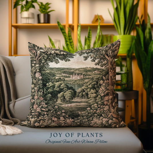 May include: Square woven pillow with a landscape scene featuring trees, a lake, and a castle. The pillow has a decorative border of leaves and flowers. The text "JOY OF PLANTS" and "Original Fine Art Woven Pillow" are at the bottom.