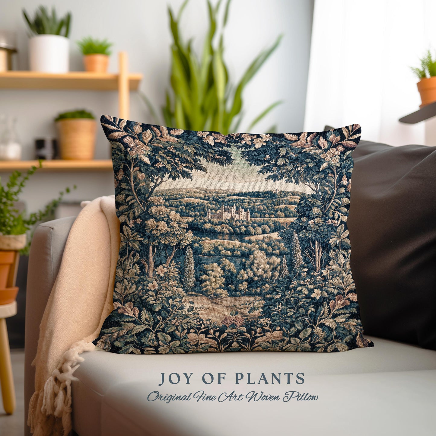 May include: A decorative square pillow with a woven tapestry design. The pillow features a detailed landscape scene with a castle, trees, and foliage in shades of blue, green, and beige. The text "JOY OF PLANTS Original Fine Art Woven Pillow" is at the bottom.