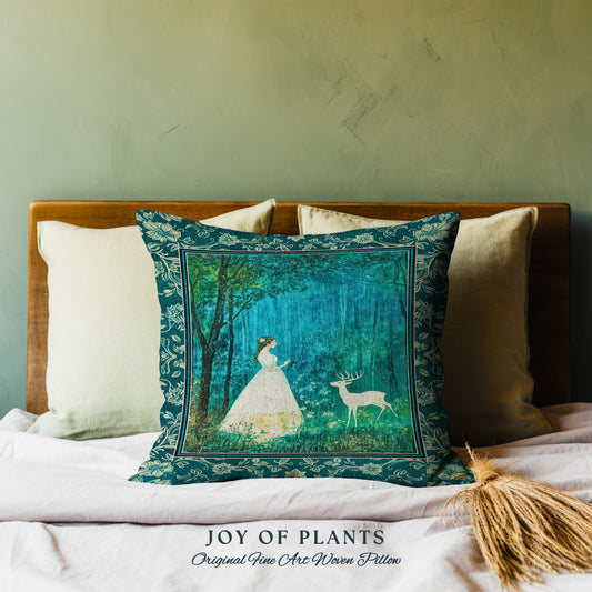 May include: Decorative square pillow with a teal floral border. The pillow features a forest scene with a woman in a white dress and a deer. The text "JOY OF PLANTS Original Fine Art Woven Pillow" is at the bottom.