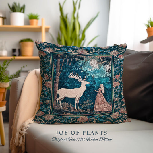 May include: A decorative pillow with a forest scene featuring a white deer, a woman in a pink dress, and mountains. The pillow has a dark teal background with floral borders and the text "JOY OF PLANTS Original Fine Art Woven Pillow".