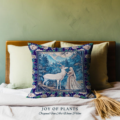 May include: A decorative pillow with a woven tapestry design. The pillow features a detailed scene of a white deer and a woman in a forest setting, framed by a floral border. The text "JOY OF PLANTS Original Fine Art Woven Pillow" is at the bottom.