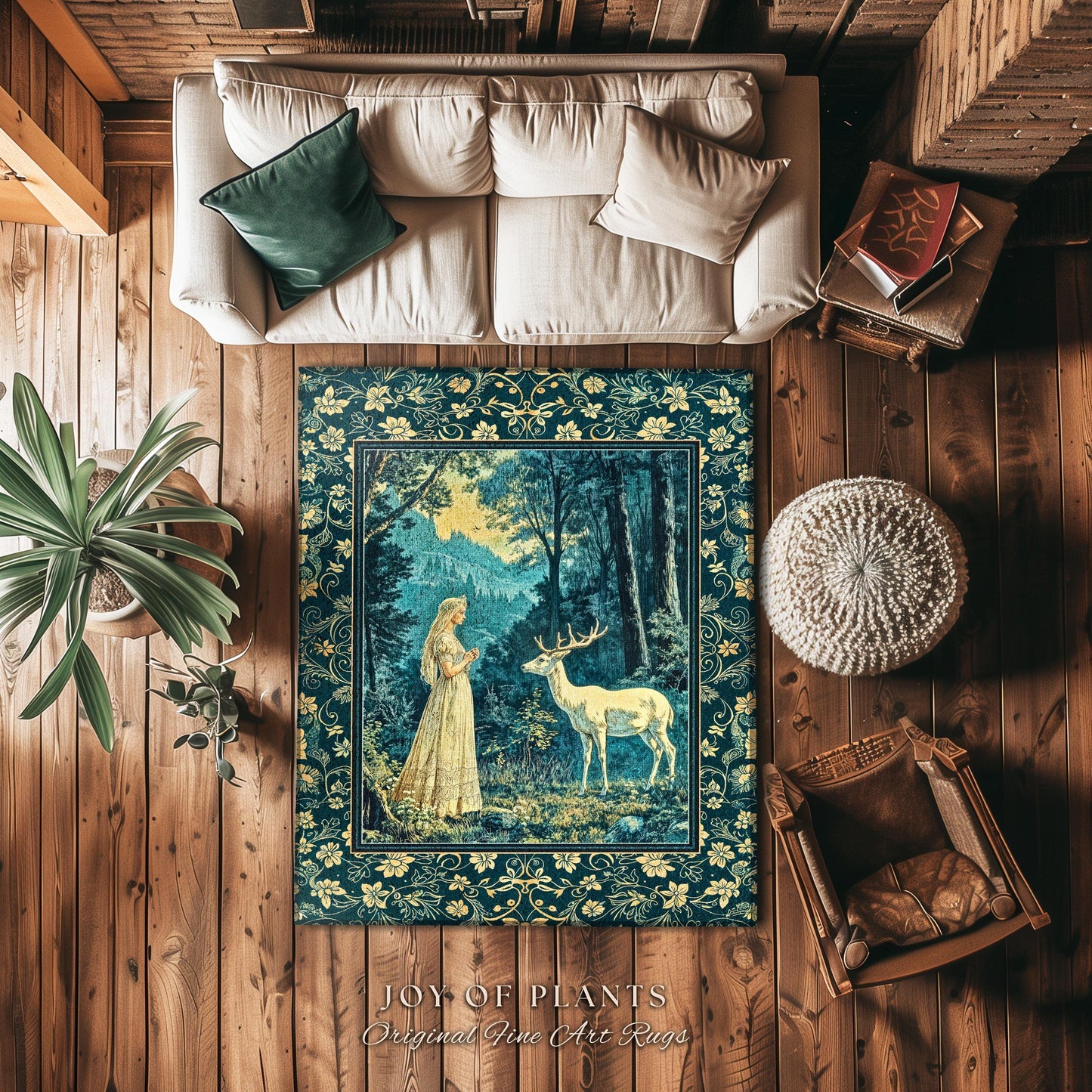 May include: A blue and gold tapestry rug with a forest scene featuring a woman in a white dress and a white deer. The rug has a border of floral designs and the text "JOY OF PLANTS Original Fine Art Rugs".