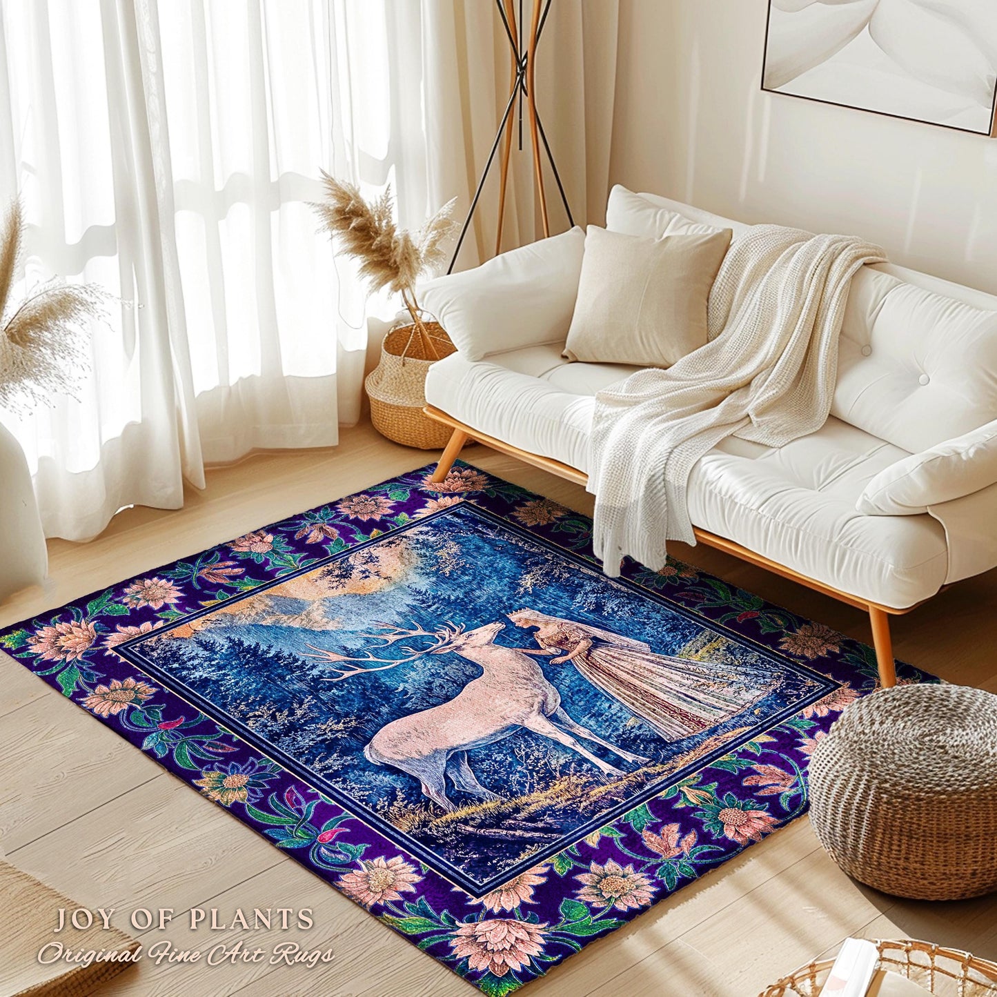 May include: A rectangular area rug with a central image of a deer and a woman in a forest scene, framed by a floral border. The rug features a deep blue background with pink, green, and purple accents. The text "JOY OF PLANTS Original Fine Arc Rugs" is at the bottom.