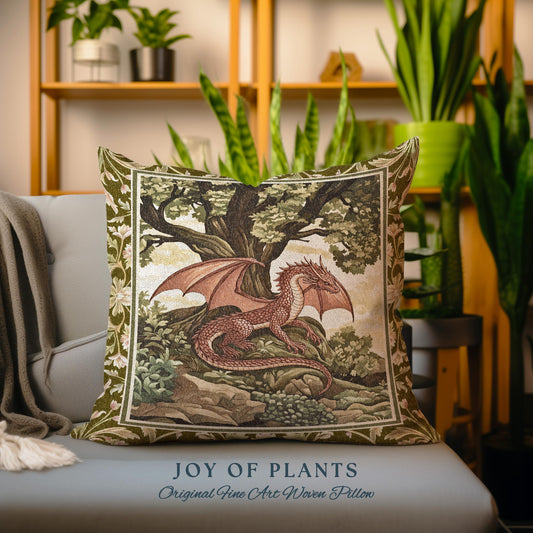 May include: A green and brown tapestry pillow with a red dragon in a forest setting. The pillow has the text "JOY OF PLANTS Original Fine Art Woven Pillow" at the bottom.