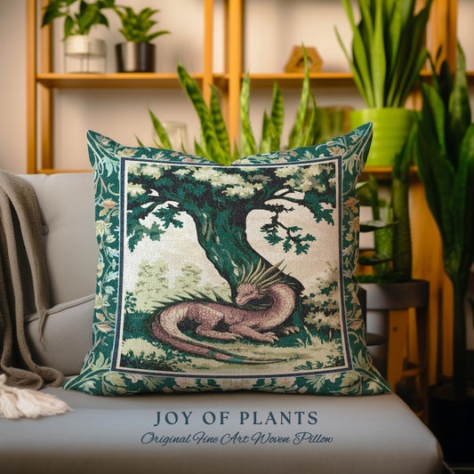 May include: A green and pink tapestry pillow with a dragon curled up under a tree. The pillow has the text "JOY OF PLANTS Original Fine Art Woven Pillow" at the bottom.