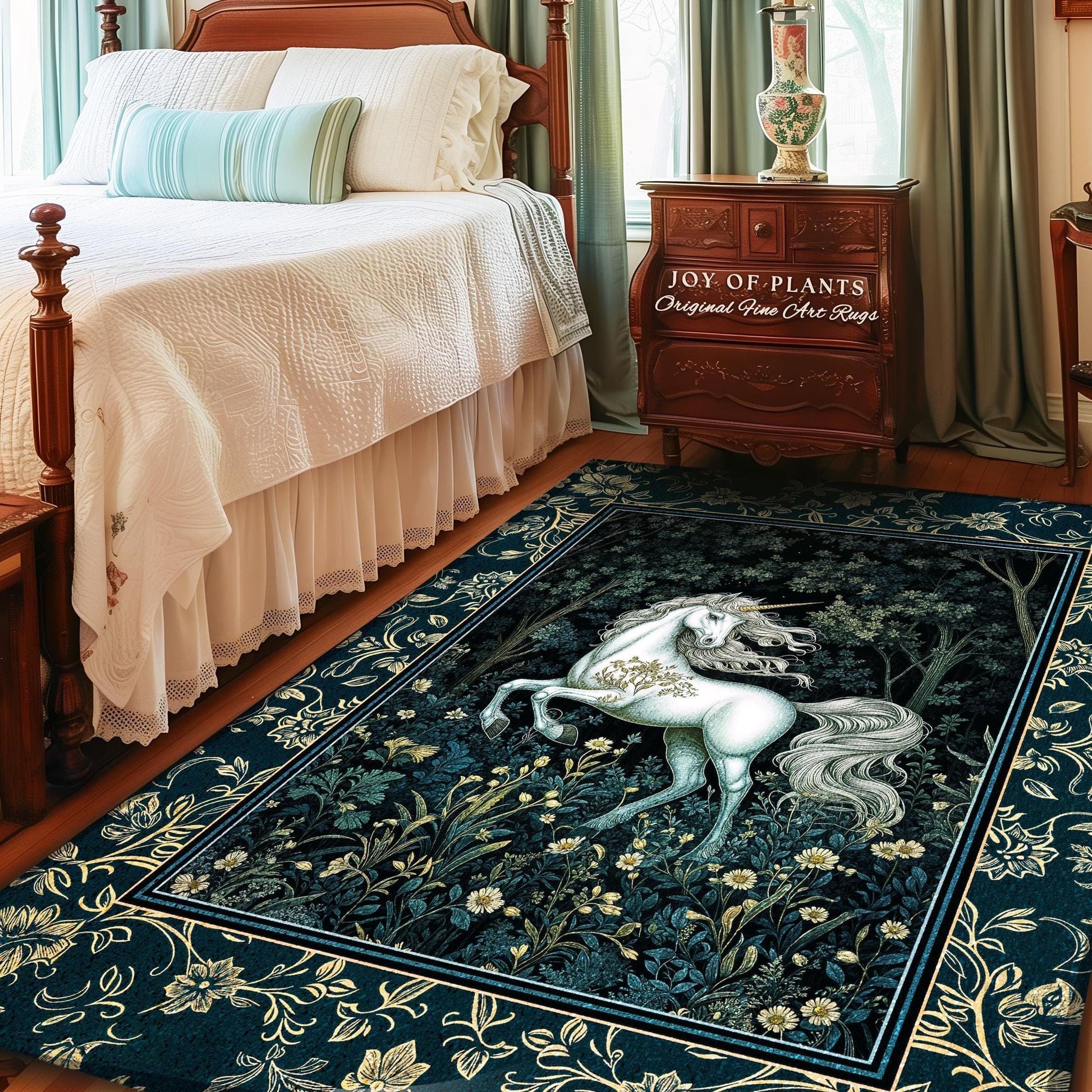 May include: A rectangular area rug featuring a white unicorn in a forest scene with a dark blue background. The rug has a floral border and the text "JOY OF PLANTS Original Fine Art Rugs". The rug is placed in a bedroom.