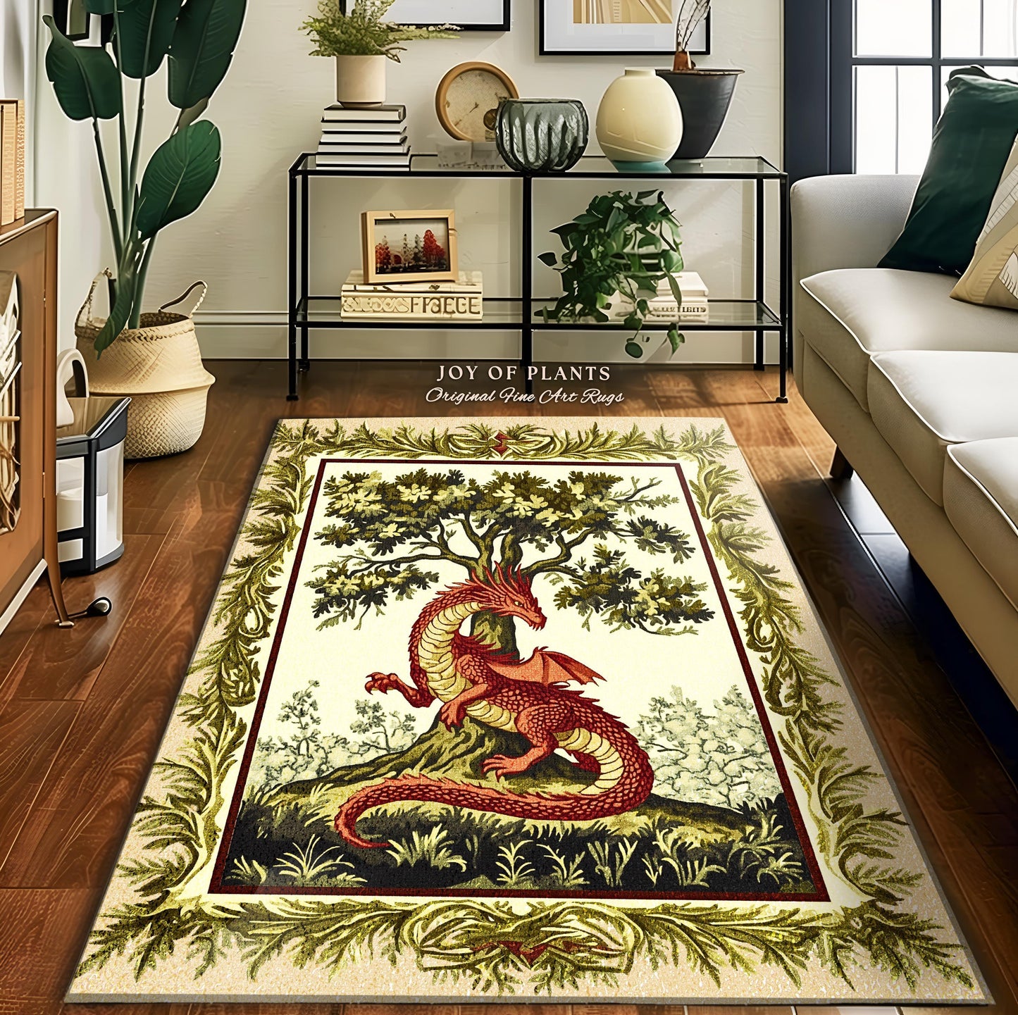 May include: A cream-colored rug with a green border and a red dragon curled around a green tree. The rug has the text "JOY OF PLANTS Original Fine Art Rugs" at the top.