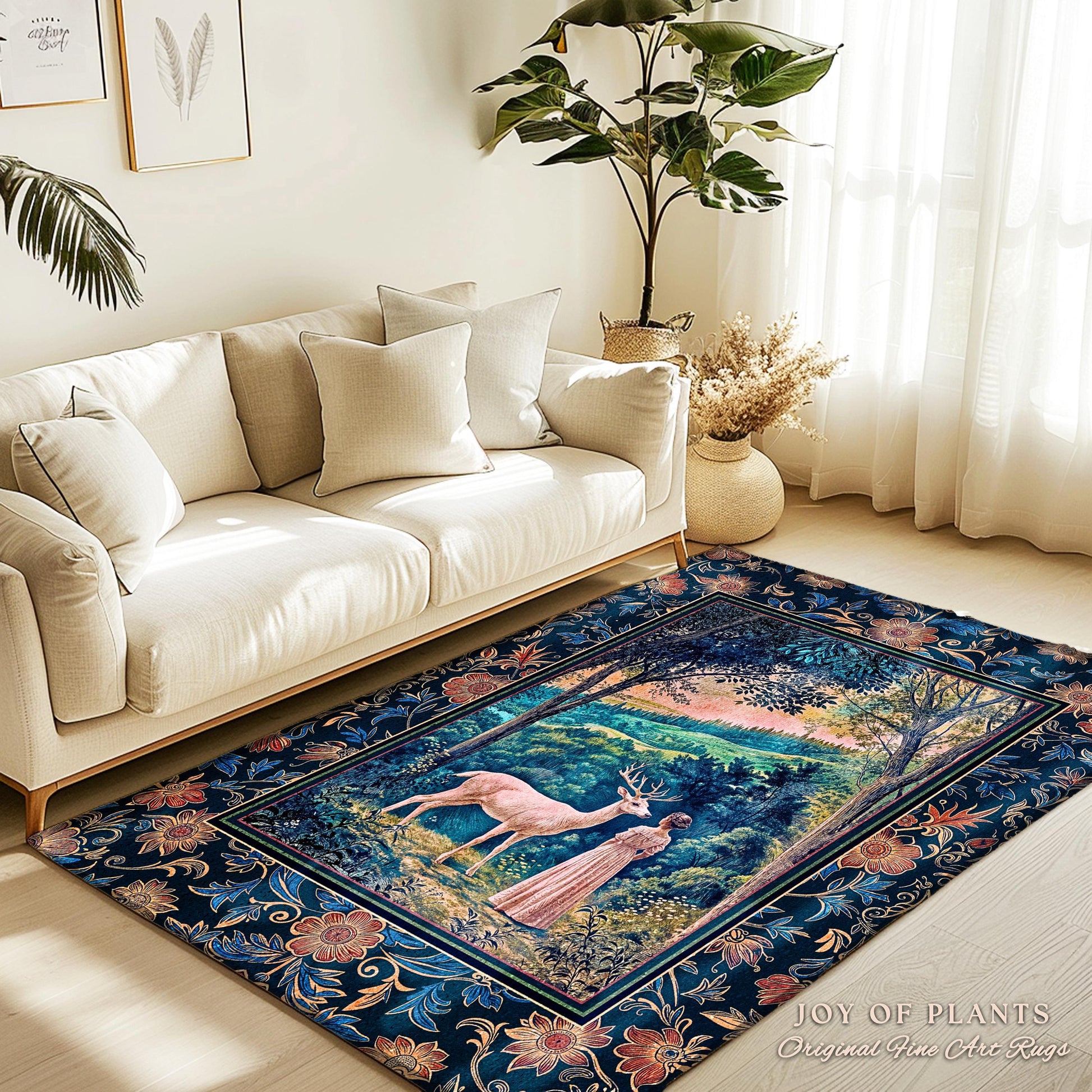 May include: A blue and floral patterned rug with a framed image of a white deer and a woman in a forest setting. The text "JOY OF PLANTS Original Fine Art Rugs" is in the bottom right corner.