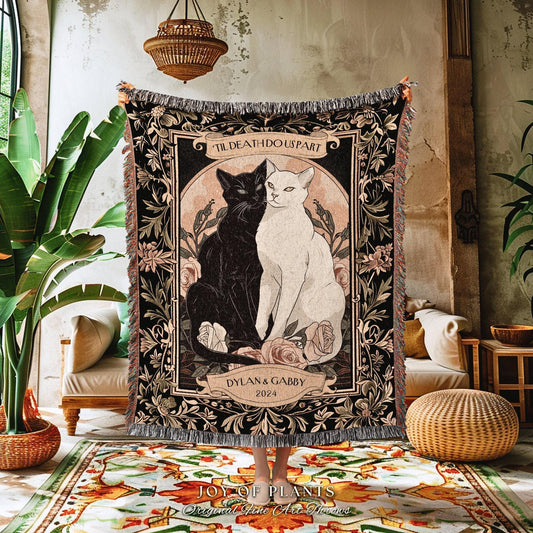 May include: A woven tapestry featuring two cats, one black and one white, with the text "TIL DEATH DO US PART" above them. The names "DYLAN & GABBY" and the year "2024" are also displayed. The tapestry has a floral border.
