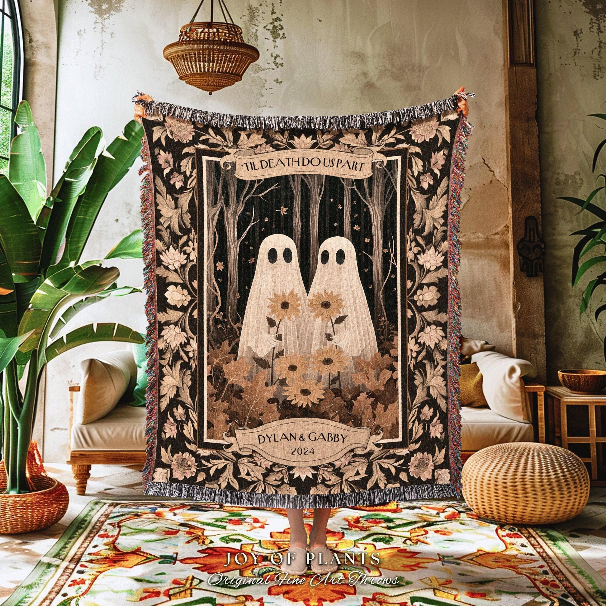 May include: A woven throw blanket with a romantic design. The blanket features two ghost figures holding sunflowers, with the text "TIL DEATH DO US PART" and the names "DYLAN & GABBY 2024". The blanket has a black background with floral and leaf accents.