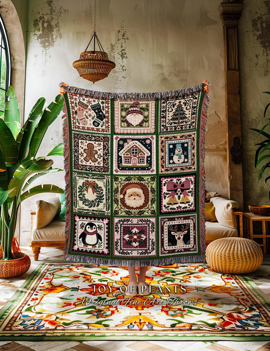 May include: A Christmas-themed throw blanket with a patchwork design. The blanket features squares with festive images like Santa, a snowman, and a reindeer. The blanket has a green border and fringed edges. The text "JOY OF PLANTS Original Fine Art Throws" is visible.