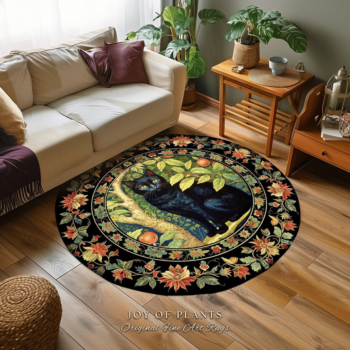 May include: A round black rug featuring a black cat resting on a tree branch with green leaves and orange fruit. The rug is bordered by a floral pattern in red, orange, and yellow. The text "JOY OF PLANTS Original Fine Art Rugs" is at the bottom.