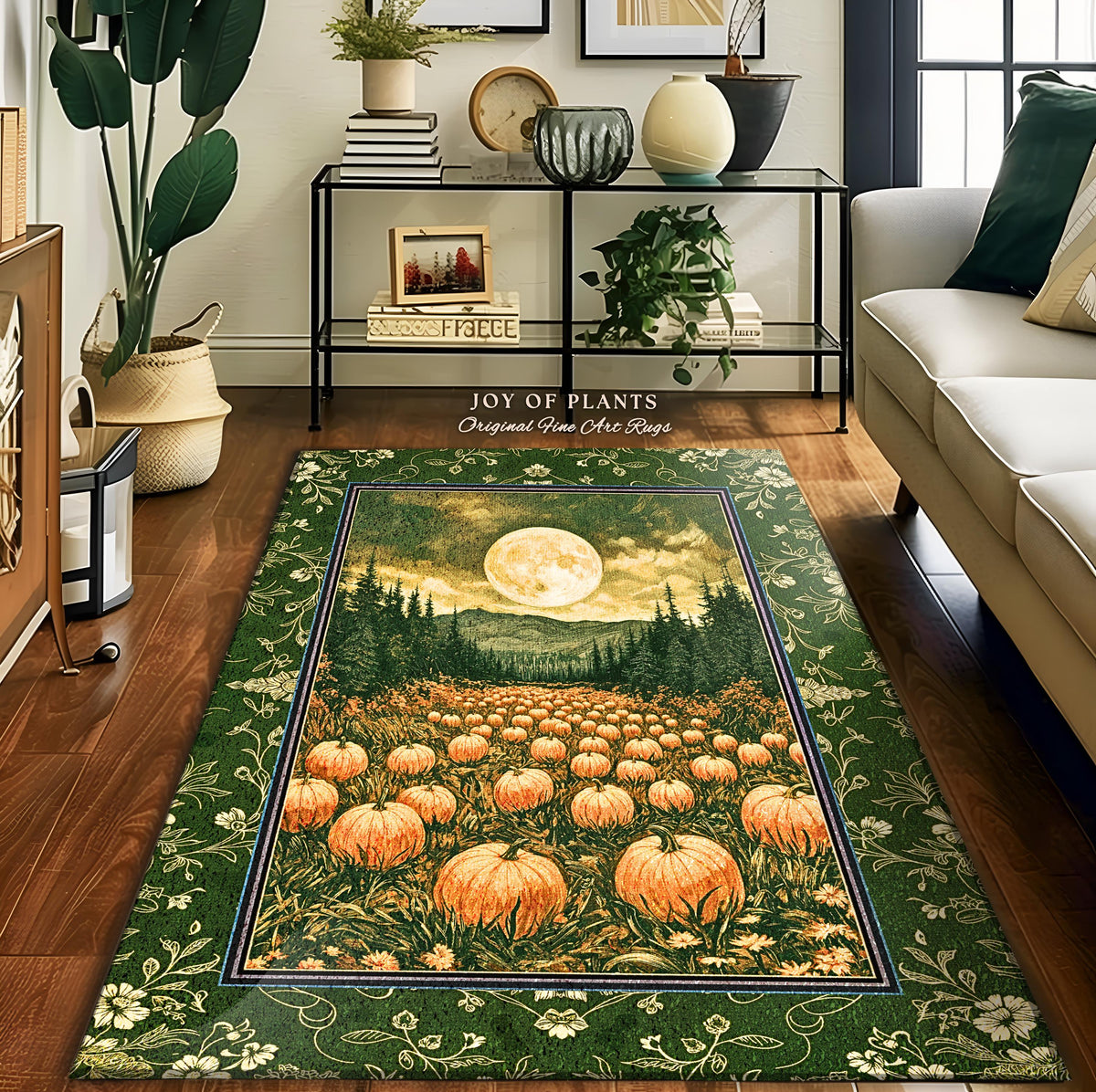 May include: A rectangular green rug with a pumpkin patch scene under a full moon. The rug has a dark green border with floral patterns and the text "JOY OF PLANTS Original Fine Art Rugs". The pumpkins are orange and the sky is yellow.