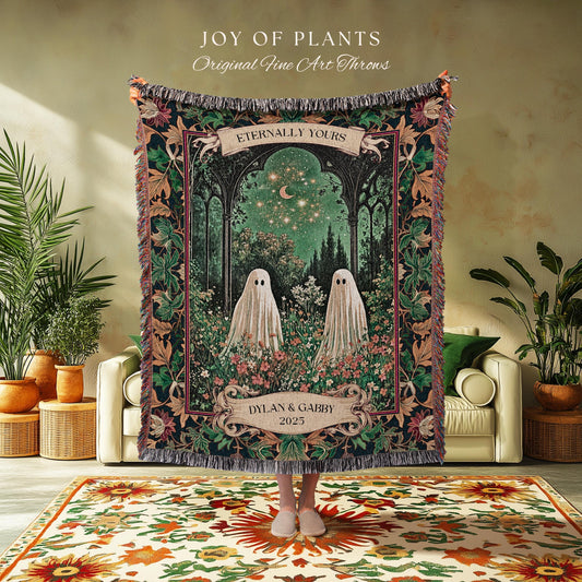 May include: A tapestry throw blanket with a whimsical design featuring two ghost figures in a garden setting under a starry night sky. The blanket has a dark background with floral and foliage borders. Text includes "JOY OF PLANTS" and "Eternally Yours."