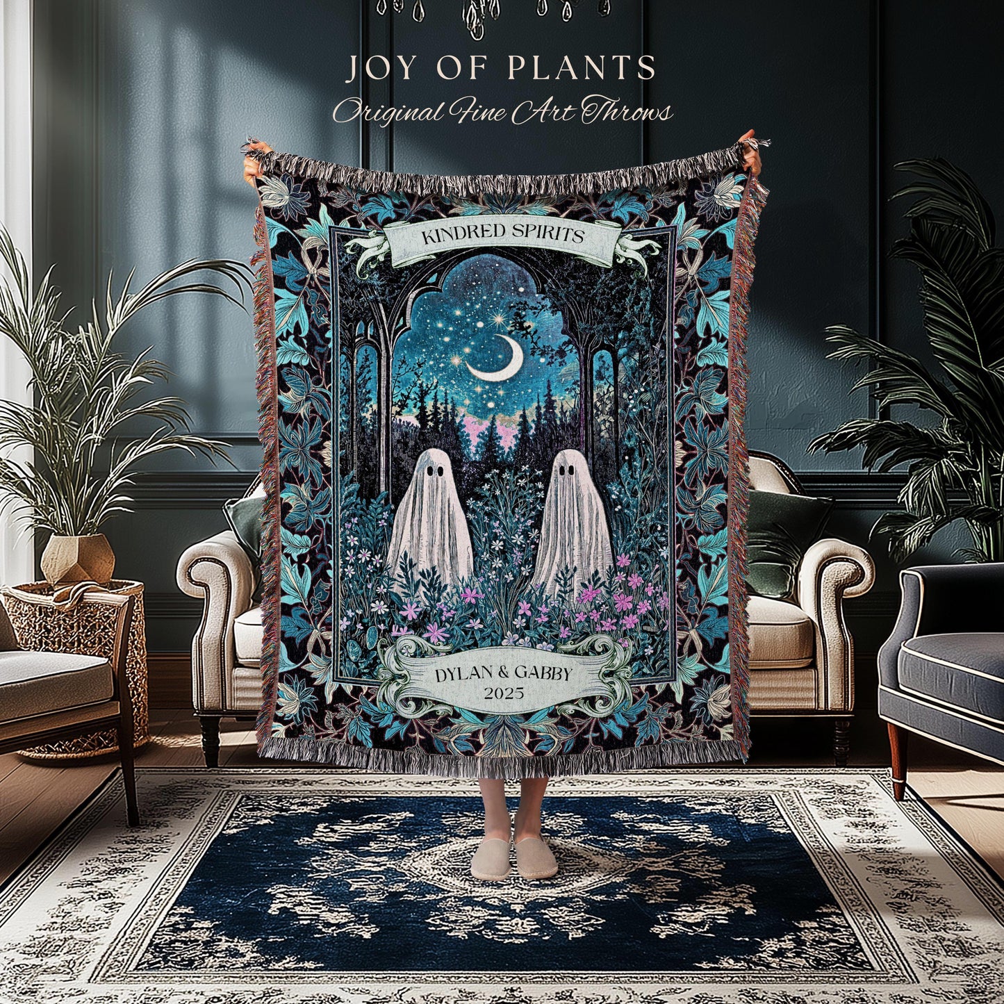 May include: A tapestry throw blanket with a whimsical design featuring two ghost figures in a forest scene under a starry night sky. The blanket has a dark blue and teal color scheme with the text "JOY OF PLANTS" and "Original Fine Art Throws". The text "KINDRED SPIRITS" and "DYLAN & GABBY 2025" are also visible.