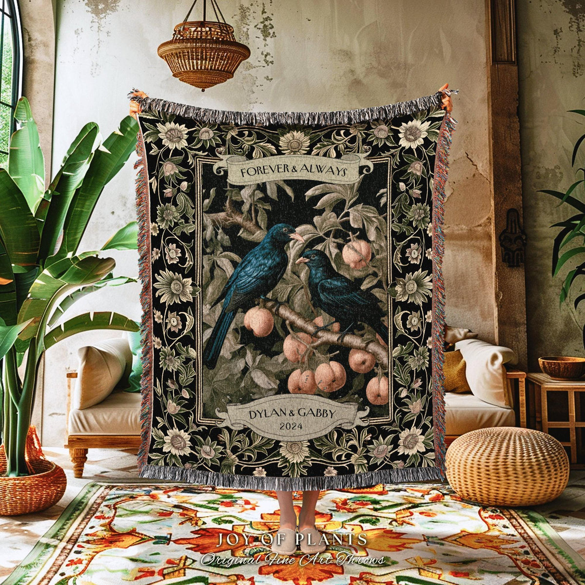 May include: A black woven throw blanket featuring a design with two blue birds perched on a branch with peaches. The words "FOREVER & ALWAYS" and "DYLAN & GABBY 2024" are displayed on the blanket. The blanket has a fringed edge.